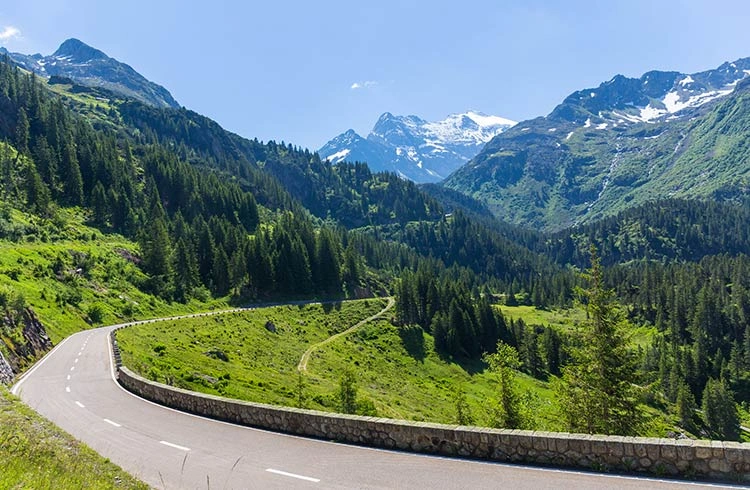 mountain roads switzerland gettyimages 1071504128 Switzerland is like nature’s playground—snow-capped peaks, quiet lakes, and charming towns every few miles. So when you’re planning a trip there, you’ll find yourself asking two big questions: should you rent a car or go for the Swiss Travel Pass and rely on one of the world’s most efficient rail systems?