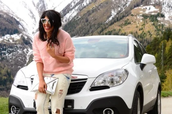 An adventurous girl using a rental car provided by mr. rent a car