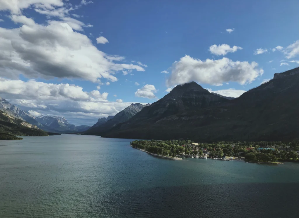 shafkat alam 8xset6t7tQA unsplash One of the most stated trips to do in Alberta is a road trip from Calgary to Waterton Lakes where the travelling party gets an opportunity to witness some of the most spectacular scenery in the Canadian Rockies. Whereas other places such as Banff and Jasper may take up most spaces in the travel guides, Waterton lakes national park has equally beautiful scenery but without the heavy crowd making it the place to visit when one wants it to be a personal experience.